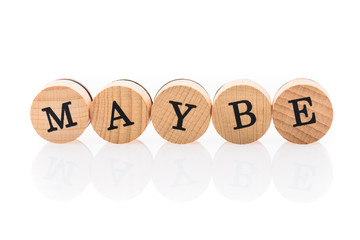 Word Maybe from circular wooden tiles with letters children toy.