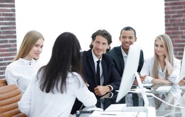 handshake business women with business partner at the negotiating table