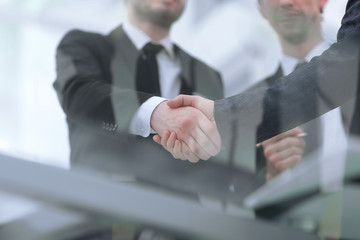 bottom view.handshake of business partners on a Desk