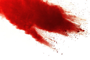Red powder explosion on white background. Paint Holi.