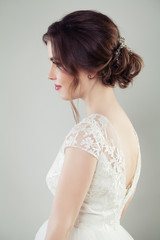 Cute woman with makeup and bridal hairstyle, profile