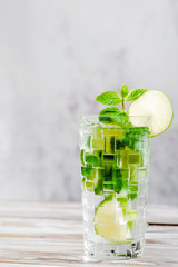 Mojito cocktail on white wood background. isolated. close up