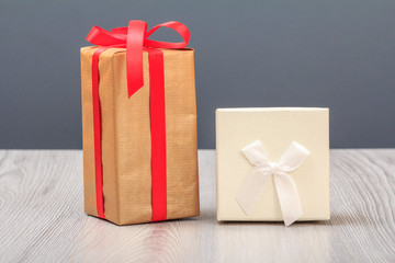 Gift boxes on wooden boards and gray background