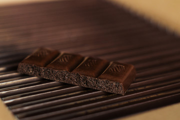 Dark chocolate on a cardboard box. Close up