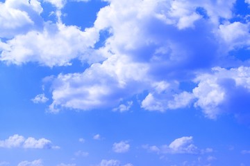 lovely toned cumulus cloudy sky for using in design as background.