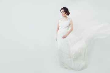 Fototapeta na wymiar Beautiful woman bride in white lacy dress