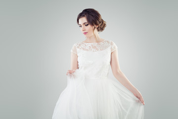 Fototapeta na wymiar Pretty girl fiancee in white bridal dress