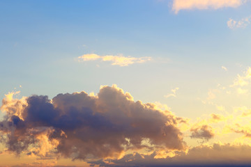 Pink vanilla heaven. Bright blue sky with gentle cumulus clouds. Dawn summer background.