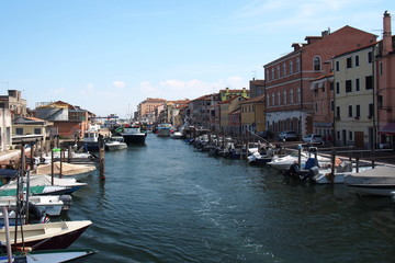 Fototapeta na wymiar Romantic town of small Venice with water channel and boats