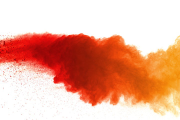 Orange powder explosion on white background. Colored cloud. Colorful dust explode. Paint Holi.