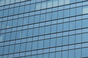 Glas facade of a business building in Ginza district, Tokyo, Japan