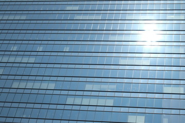 Fototapeta na wymiar Glas facade of a business building with reflecting sun in Ginza district, Tokyo, Japan