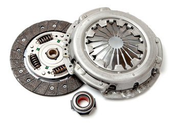 Set of replacement automotive clutch isolated on white background. Disc and clutch basket with release bearing. - obrazy, fototapety, plakaty