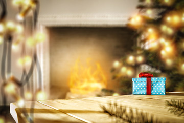 Table background with gifts and fireplace with christmas tree 