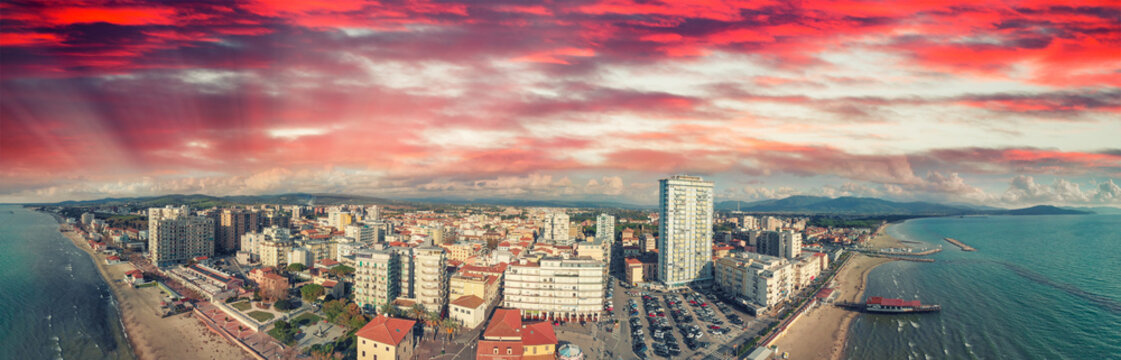Panoramic aerial view of Follonica, Italy. Coastline of Tuscany with town and ocean