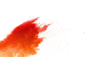 Orange powder explosion on white background. Colored cloud. Colorful dust explode. Paint Holi.