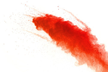 Orange powder explosion on white background. Colored cloud. Colorful dust explode. Paint Holi.