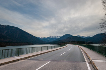 Bridge and country road at Lake Sylvenstein in Bavaria, Germany.