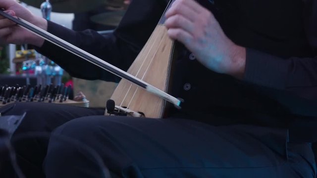 playing fiddle at a concert