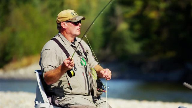 Freshwater fly fishing from rib boat on the rive USA