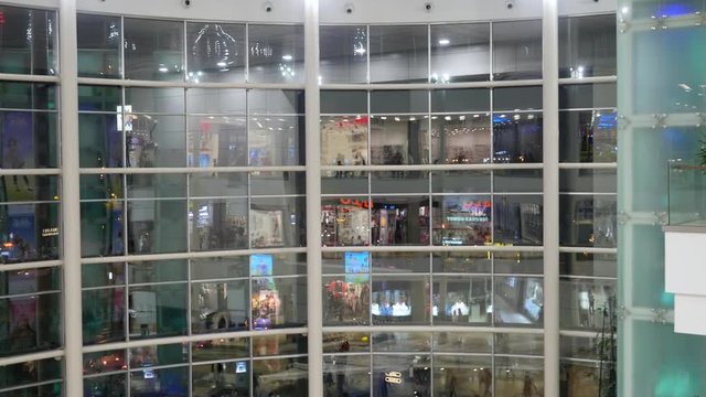 Reflection of people in the shopping mall window