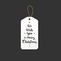 Vintage style christmas tag with we wish you a maerry christmas text. Whtie and gold gift hanger for the holidays.