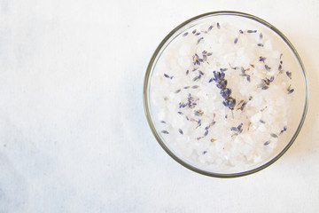 Obraz na płótnie Canvas lavender bath salt on white background with lavender flower