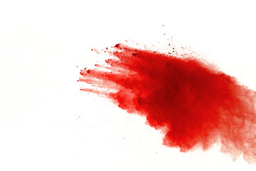 Red powder explosion on white background. Paint Holi.