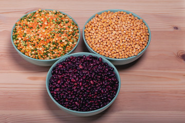 The concept of natural healthy food. Bobs, beans, and peas in bowls closeup