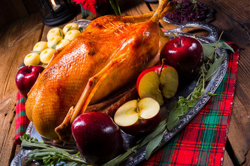 festive stuffed roast goose with red cabbage and dumplings
