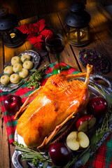 festive stuffed roast goose with red cabbage and dumplings