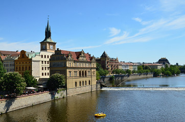 Fototapeta na wymiar View from Charles Bridge to the capital city of Prague Kampa