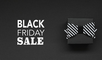Gift box on black background and Black Friday Text