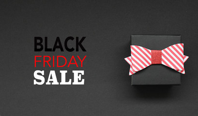 Gift box on black background and Black Friday Text