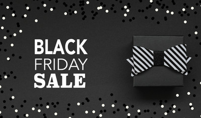 Gift box on black background and Black Friday Text
