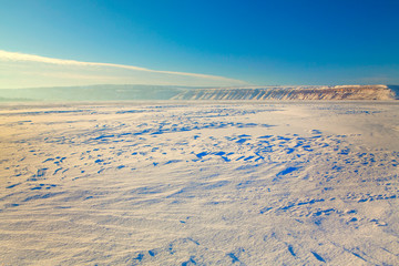 frozen lake surface in the winter 