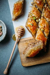  Perfect sweet baklava with pistachio on marble background