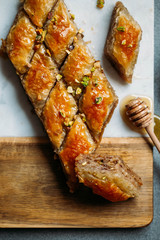  Perfect sweet baklava with pistachio on marble background