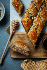  Perfect sweet baklava with pistachio on marble background