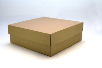 cardboard box with lid lies on white background in different angles