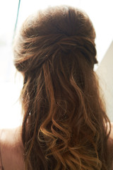 closeup of hair clip on bride's hair. wedding hairstyle, morning of the bride