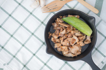 Stir fried pork mix garlic eating with cucumber