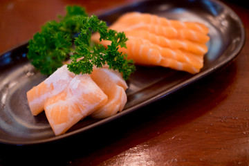 Raw salmons fillet on dish in restaurant