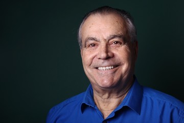 Fototapeta premium Beautiful older man in front of a colored background