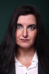 Portrait of a woman in front of a colored background