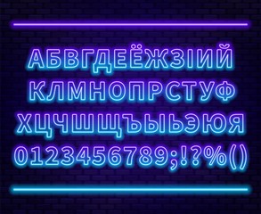 Fototapeta premium Neon Cyrillic alphabet with numbers on the brick wall background. Can be used for Belarusian and Ukrainian languages.