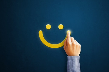 Hand of client show a feedback with smiley face. Service rating, satisfaction concept