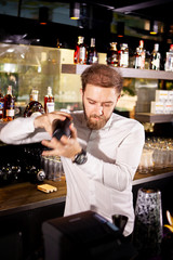 Alcohol cocktail on the bar. Bartender prepares an alcoholic cocktail . Delicious drink