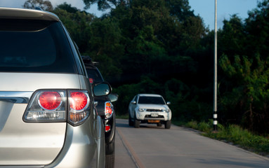 Fototapeta premium Cars on the road heading towards the goal of the trip, tourism by car, Break in traffic junction.
