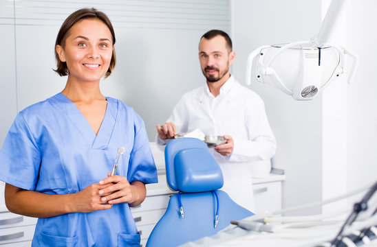 Portrait of dentist and assistant